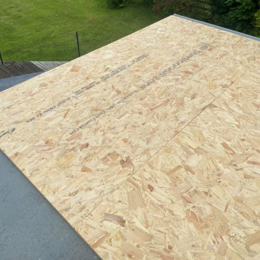 Flat roof repair work being carried out on a Newcastle home