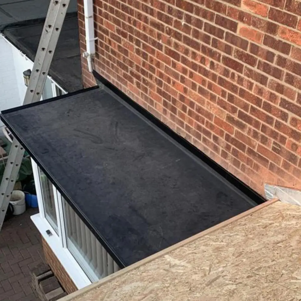 GRP fibreglass flat roof finished in light grey