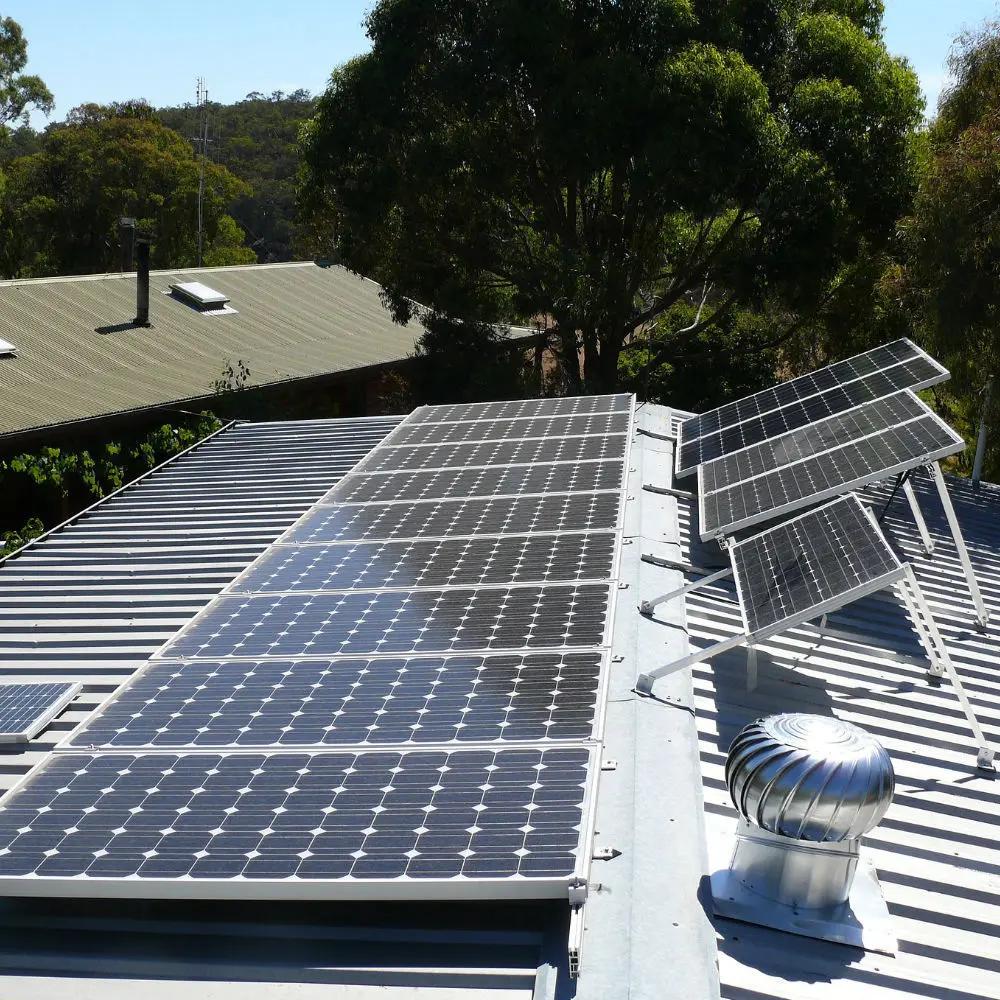 Solar panels installed on a flat roof using ballasted tilt frames